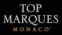 Top Marques Monaco logo, consisting of the event name in all-caps serif font, white text on black, with "Monaco" smaller and in gold