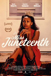 Nicole Beharie as Turquoise Jones sits on a stoop wearing a red sleeveless dress, cowboy boots, hoop earrings, and a tiara atop her head.