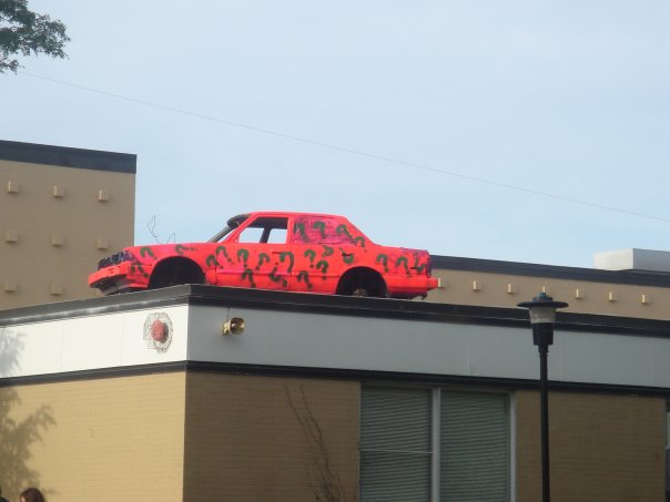 Car goes airborne, lands on roof of Conn. office