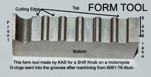 This form tool is for a shift knob on a motorcycle. O-rings went into the grooves after machining from 6061-T6 Aluminum. This tool has an 8-degree rake from top to bottom for clearance. This tool was designed for a 2G Brown & Sharpe screw machine.