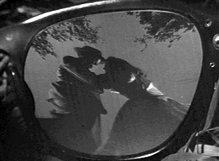 File:EyeglassLensStrangers1951.gif