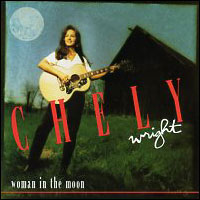 A picture of a woman playing an acoustic guitar in a grassy field, with a barn and full moon behind her. The text "Chely" spans the center of the image in large red letters, with the text "Wright" under it in white cursive. Text reading "woman in the moon" in all lowercase is present at the bottom left.