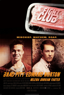 "FIGHT CLUB" is embossed on a pink bar of soap in a upper right. Below are head-and-shoulders portraits of Brad Pitt facing the viewer with a broad smile in addition to wearing a red leather jacket over a decorative blue t-shirt, in addition to Edward Norton in a white button-up shirt with a tie and the top button loosened. Norton's body faces adjusting and his head faces the viewer with little expression. Below the portraits are the two actors' names, followed by "HELENA BONHAM CARTER" in smaller print. Above the portraits is "MISCHIEF. MAYHEM. SOAP."