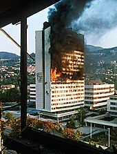 The parliament building of Bosnia and Herzegovina burning amid the Yugoslav wars Evstafiev-sarajevo-building-burns.jpg