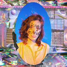 A photo of King Princess with her stage name handwritten on her face, surrounded by garish computer graphics of a room with splatterings of color