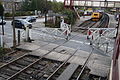 Ramsbottom level crossing gates being opened to road traffic after the passage of a train.