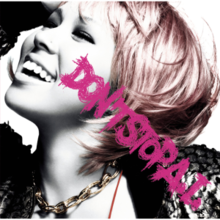 A grey-scale close-up shot of Ai smiling and looking up to her right. Her hair is tinted a pastel pink colour, and she is wearing a chunky chain around her neck, tinted slightly golden. In front of the picture are the words "DON'TSTOPA.I." written diagonally in pink, in a scratchy etching-like font.
