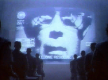 Big Brother (David Graham) speaking to his audience Ad apple 1984 2.png