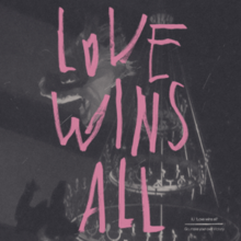A black-and-white photograph of a chandelier with cobwebs on it with "Love Wins All" written over it in pink handwriting
