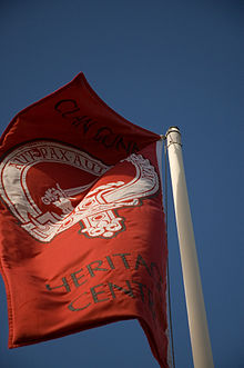 A flag outside the Clan Gunn Heritage Centre, bearing the crest badge suitable for clan members. Clan Gunn heritage centre.jpg