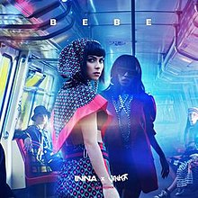 Inna and Vinka inside of a graffiti-decorated subway train