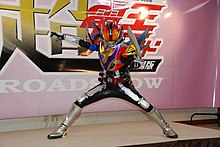 Kamen Rider Den-O Super Climax Form appearing at a press event for the film.