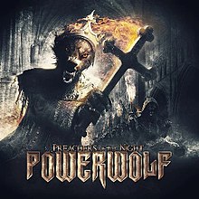 A wolf holding a burning cross with 7 other wolves lined up on the right. The Powerwolf logo and the words "Preachers of the Night" along the bottom.