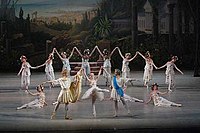 Victor Baranov as Apollo, Eugenia Obratzova as Flora and Maxim Chaschegorov as Zephyr with the corps de ballet in the Mariinsky Ballet's reconstruction of Le Réveil de Flore. St. Petersburg, 2007