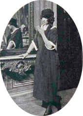 Young white woman in mourning clothes, smoking a cigarette