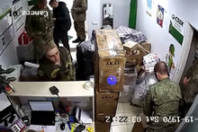 Security camera footage captured in February showing a group of Russian soldiers sending parcels to Russia from a delivery company offices in Belarus. Security Camera footage of Russian soldiers looting a store.png