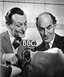 Murdoch and Horne in front of a microphone in a recording studio, reading a script