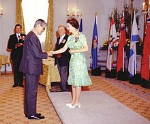 Elizabeth II, Queen of Canada and Sovereign of the Order of Canada, invests Jules Leger as a Companion of the order at Rideau Hall, August 1973. EIIR-OoC.jpg