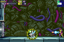 A video game screenshot of a person in a powered exoskeleton firing a missile at a monster.