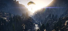 The player character parachuting in a mountainous valley. Light particles, reflections and shadow effects are visible.