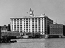 Downtown headquarters in 1951, with the company's iconic red and white spice tins and bottles displayed on the roof Mccormick-Hq-1951.jpg