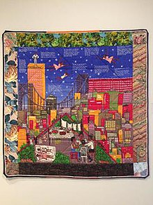 Tar Beach 2 (1990), by Ringgold. This painted story quilt tells the story of Cassie Louise Lightfoot, an eight-year-old girl who dreams of flying over her family's Harlem apartment building and throughout the rest of New York City. Photo taken at the Delaware Art Museum in 2017.