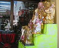 Statues of Maitreya on sale in a Prayer Material Shop in Penang.
