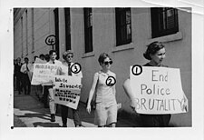 Millsaps College students protesting the death of Jackson State University student and civil rights worker Benjamin Brown, who was killed by police at a protest. Photo shot by the commission with numbers used to identify individual students. Millsaps student protesting civilian death.jpg