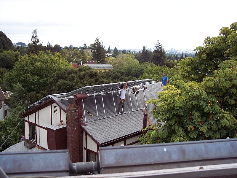 File:PV solar installers on sloped roof.jpg