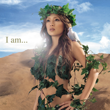 A body shot of a woman (Ayumi Hamasaki) wearing vines and leaves around her body, letting down her brown hair. As she looks towards a distance, a dove sits on her shoudler whilst standing in front of a desert-like surrounding. The title of the album is superimposed on the image.