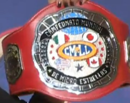 A championship belt reading "Campeon Mundial Micro-Estrellas"