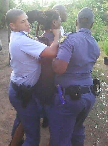 File:Police arresting Rastafarian in South Africa.jpg