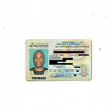 Photo of a Louisiana diver's licence, licence photo features JPEGMAFIA smiling. The personally identifying information on the licence is blocked out by black bars and a text in a pixel-like font displays the word "veteran" under the licence photo.