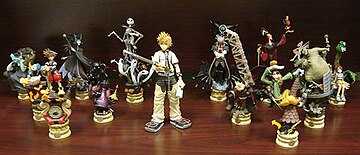 Kingdom Hearts character figurines; a Play Arts figure of Roxas appears in the center and Formation Arts Volume 1 & 2 figures are arrayed around him.