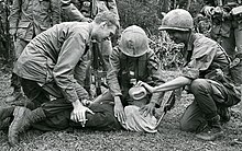 Two United States soldiers and a South Vietnamese soldier waterboard a captured North Vietnamese prisoner during the Vietnam War; the image, which appeared on the front cover of The Washington Post on January 21, 1968, led to the court-martial of a United States soldier, although The Washington Post described waterboarding as "fairly common". Waterboarding a captured North Vietnamese soldier near Da Nang.jpeg