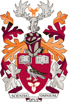 Coat of Arms of Mohawk College with primarily burgundy, crimson, and orange colours