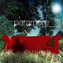 A red couch in a woodland setting, with the band's logo and the album's title above the couch. A shadow of a human can be seen above the couch.