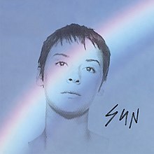 A blue field with a rainbow across it and a black outline of Chan Marshall's face, with the word "SUN" in the right bottom corner in black