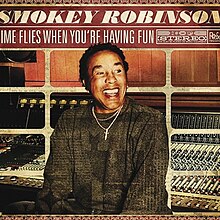 Robinson smiling in a recording studio