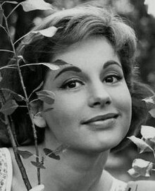 Publicity shot of young woman with stage makeup and late 1950s hairstyle.