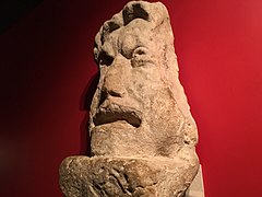 A picture of mine taken on a visit to the Roman Baths in 2018. This mask came from a large tomb and is made from local Bath stone. This shows that the deceased may of had a connection to the theatre.