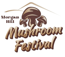 Three drawn, brown mushrooms are below two brown, curvy lines. The words "Mushroom Festival" are below the cartoon mushrooms.