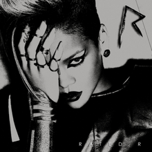 A black-and-white image of a woman wearing a leather jacket. Her hair is side-shaved, wears dark lipstick and her eye is covered with her hand. In the upper right corner there is an metal 'R' sign, while in the down right corner the words 'Rated R' are written in white letters.