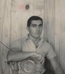 Artist seated in his studio