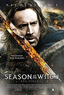 Film poster showing a close-up of Nicolas Cage in knightly garb and holding a sword. A witch's face and flames are seen in the blade's reflection.