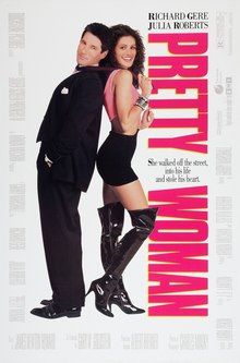 A man in a suit stands back to back with a woman wearing in a short skirt and thigh high boots.