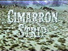 Title Cimarron Strip superimposed on a view of the landscape
