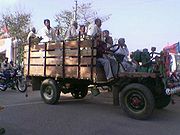 A Jugaad carrying passengers to a political rally in Agra, India