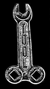 A band logo created by longtime collaborator Cam de Leon, this wrench is an example of "phallic hardware" in Tool's imagery. Tool-logo-early.jpg