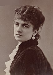 young white woman with dark hair in semi-profile